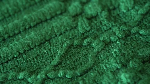 Macro with movement of soft green knitted fabric, extreme close up of cloth Stock Footage 244688226