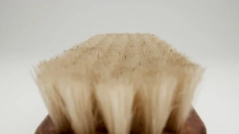 MACRO: Moving along the bristles of the clothes brush Stock Footage 174556635