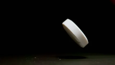 MACRO: One pill falls in the darkness - Slow motion Видео 145825763