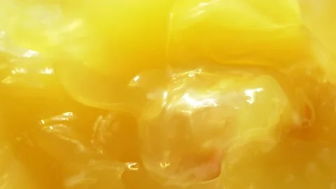 Macro orange fruit slice falling down into fresh orange juice drink, slow motion Stock Footage 141747274