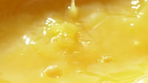 Macro orange fruit slice falling down into fresh orange juice drink, slow motion Stock Footage 142187909