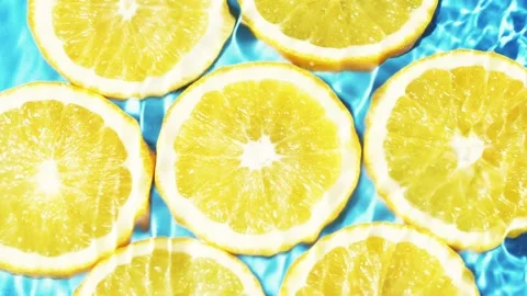 Macro orange fruit slices and blue water surface texture with ripple and splash Vídeos de archivo 170282385