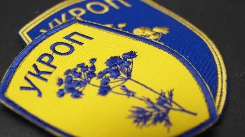 Macro Orbit of Ukrainian Ukrop Patch, Bold Colors and Stylized Design Stock Footage 302289717