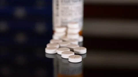 Macro of oxycodone opioid tablets Stock Footage