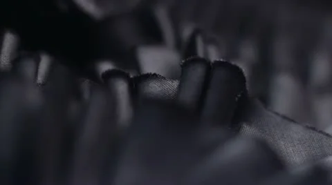 A macro pan of Dark material Stock Footage 12127628