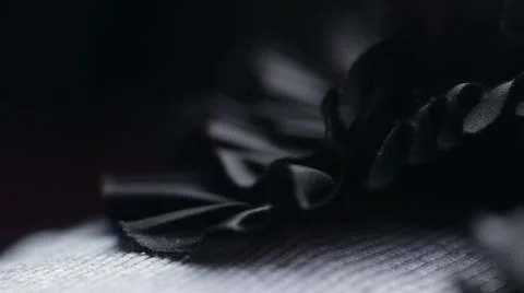 A macro pan of Dark material Video stock 12128275