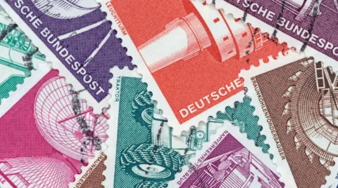 Macro pan over a heap of German postage stamps (Editorial) Video stock 59554554