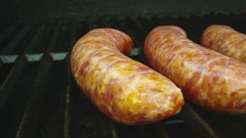 Macro pan in slow motion of sausages on a bbq grill Stock Footage 131689323