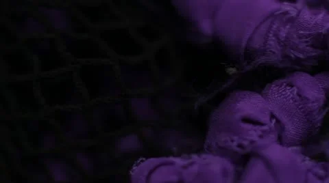 A macro pan of Violet material Stock Footage 12127388