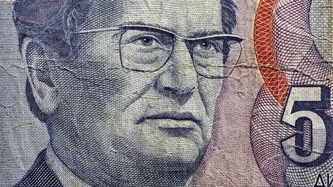 Macro Pan of Worn Yugoslav 5000 Dinar Note with Portrait Stock Footage 316878340