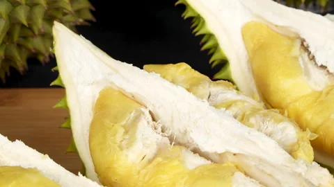 Macro panning Ri6 durian with vibrant golden flesh in studio. Stock Footage 335082905