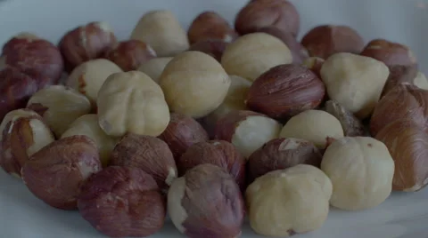 Macro panorama of peeled hazelnuts. Close up slow rotating dolly shot. 動画素材 68035294