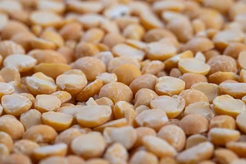 Macro pattern yellow split peas abstract, artistic minimalism with repeating org Foto stock