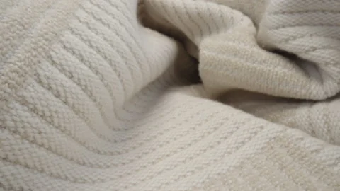 Macro patterned wool fabric. Slider dolly close-up plaid beige color texture Stock Footage 234148449