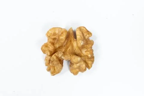 Macro peeled walnut, kernel, white isolate background, top view. Stock Photos