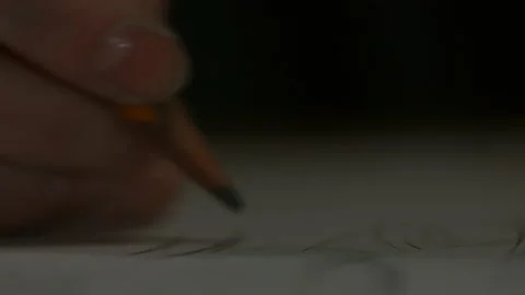 Macro pencil writes hand Stock Footage 147554335