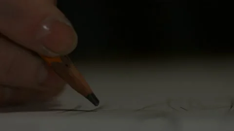 Macro pencil writes hand Stock Footage 147554336