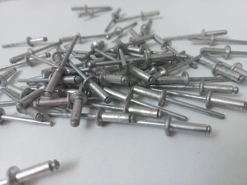 Macro Perspective Shot of Stacked Pop Rivets Stock Photos