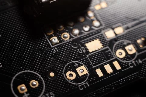 Macro photo of a black computer printed circuit board with selective focus pl Stock Photos