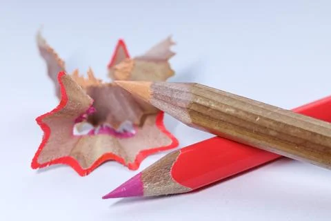 Macro photo of coloring pencil and pencil shavings on white background Stock Photos
