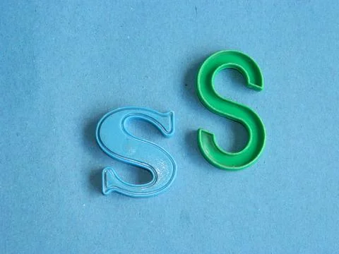 Macro photo of a combination of letters from small children's colorful toy .. Stock Photos