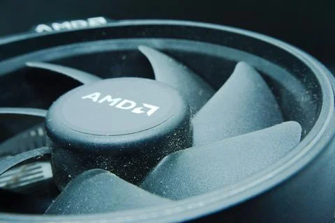 Macro photo of computer cooling fan, logo AMD on cpu fan. Stock Photos