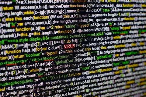Macro photo of computer screen with program source code and highlighted VIRUS Stock Photos