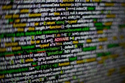 Macro photo of computer screen with program source code and highlighted ADWARE Stock Photos