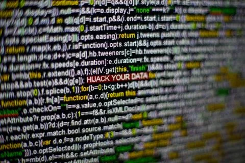 Macro photo of computer screen with program source code and highlighted HIJACK 스톡 사진