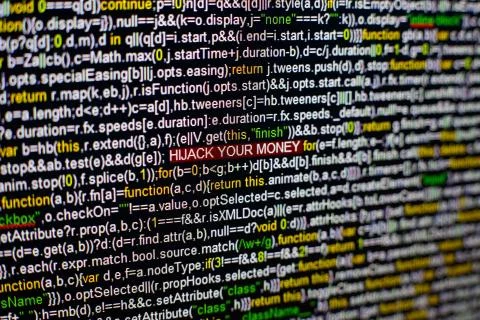 Macro photo of computer screen with program source code and highlighted HIJACK 스톡 사진