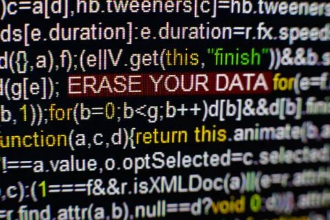 Macro photo of computer screen with program source code and highlighted SPYWARE 스톡 사진