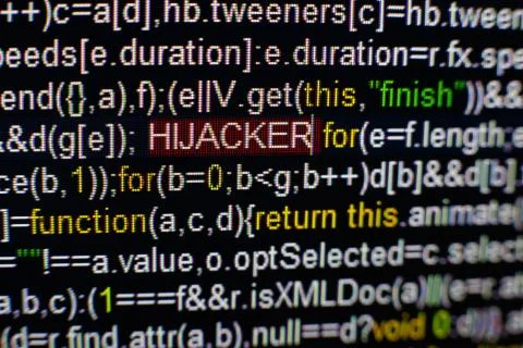 Macro photo of computer screen with program source code and highlighted HIJACKER Stockfoto's