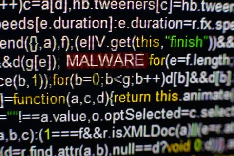 Macro photo of computer screen with program source code and highlighted MALWARE Stock Photos