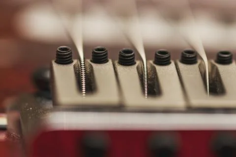 Macro photo of a guitar strings in perspective. Parts of the guitar. Stock Photos