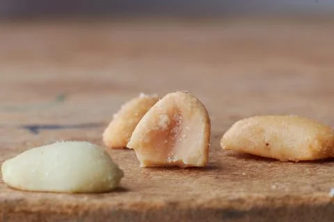 Macro photo of nuts on a wooden table, peanuts, beer snacks, blurred background Stock Photos