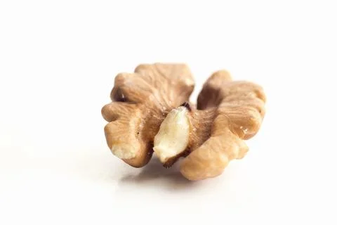 Macro photo of walnut kernels on a white isolated background Stock Photos
