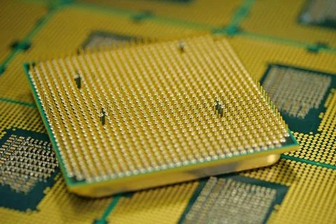 Macro photograph of processor pins emphasizing precision engineering in ele.. Stock Photos
