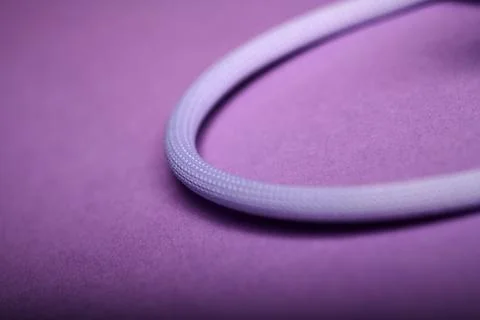 Macro photograph of a purple cable for data and power transfer Foto stock