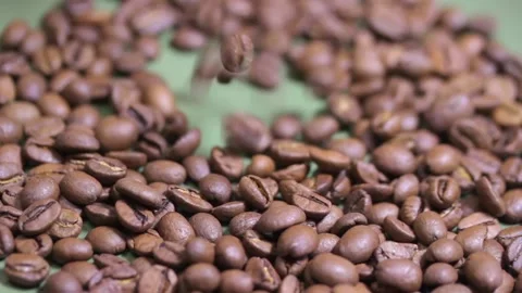 Macro photography of coffee beans that fall on a plate Video stock 155888464