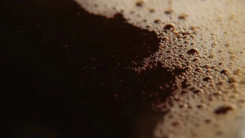 Macro photography of coffee, dropping a drop of coffee into a liquid. Stock Footage 137858338