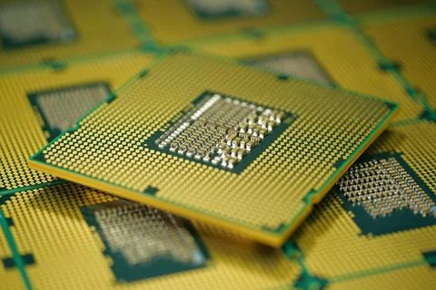 Macro photography of CPU showing tiny pins that transmit electrical signals Photos