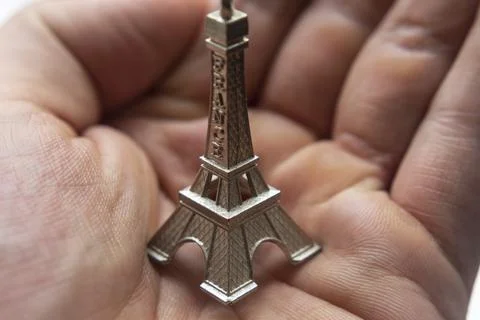 Macro Photography to mini Eiffel Tower  in a hand palm 스톡 사진
