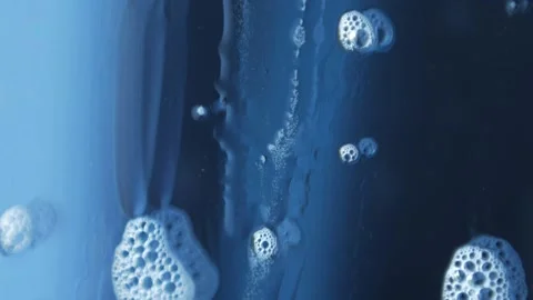 Macro photography of soap bubbles the window cleaning chemistry flows down the Stock Footage 153700179