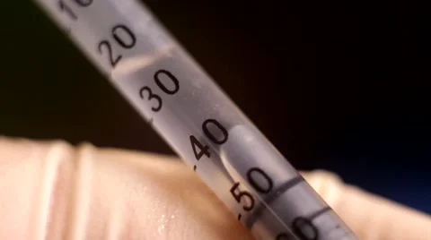 Macro photography of a syringe with the liquid Stock Footage 67397352