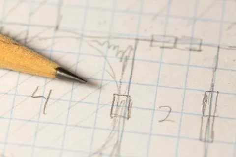Macro picture of sharpened pencil over a drawn game map Photos