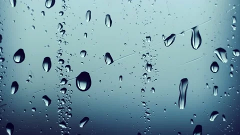 Macro plan. raindrops roll down the glass. storm. Stock Footage 234422254