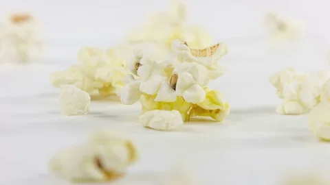 Macro popcorn close up rotation on a white background Video stock 76270119