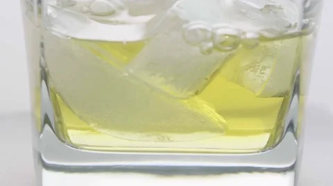 Macro pouring alcohol on ice Stock-Footage 68002856