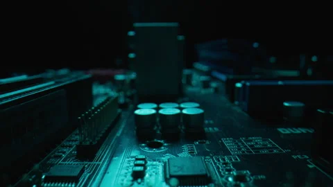 Macro power components directing energy flow in motherboard digital device. Stock Footage 332674171