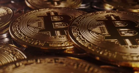 Macro probe lens flying over a stack of bitcoin. Stock Footage 163350094